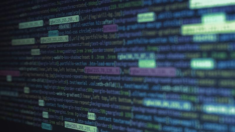 Close-up of source code on a dark screen